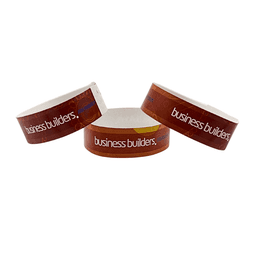 Three glossy wristbands featuring a brown background and a logo, showcasing vibrant full colour prints.