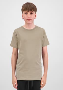 A short sleeve tee in a muted beige colour, displayed on a model with a neutral background. Features a subtle logo.