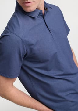 A short sleeve polo in navy blue with a collar and a branding logo.