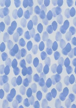 A blue and white tunic featuring a stardust print with abstract spot patterns. The design has a soft, watercolour effect.