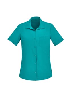 A plain short sleeve shirt in a vibrant teal colour, featuring a collar and a front pocket, with a logo.