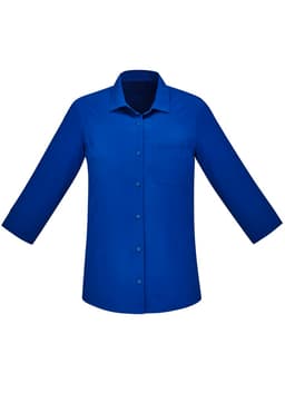 A blue women's button-up shirt with 3/4 sleeves and a pocket on the front. It features a brand logo.