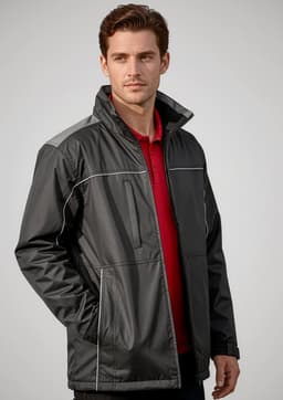 A man models a black unisex reactor jacket with grey accents, featuring zip pockets and a collar.