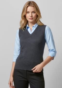 A grey women's vest with a v-neck design, worn over a light blue shirt and paired with black trousers.
