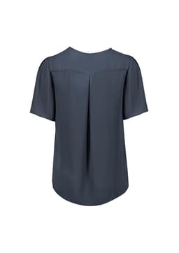 A grey women's short sleeve blouse with a pleat detail at the back and a relaxed fit. It features a simple design and has a logo.