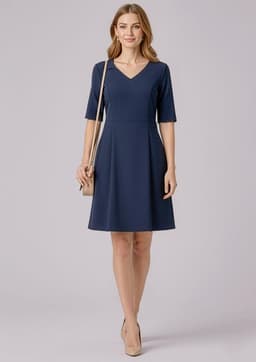 A navy short sleeve dress with a V-neck and a fitted waist, complemented by a neutral handbag.