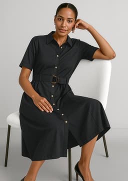 A black midi dress with short sleeves, a button-down front, and a belted waist, displayed on a seated model.