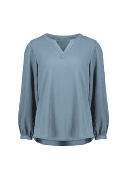 A light blue long sleeve blouse featuring a V-neck and ruché detailing. The blouse has a subtle texture and a relaxed fit.