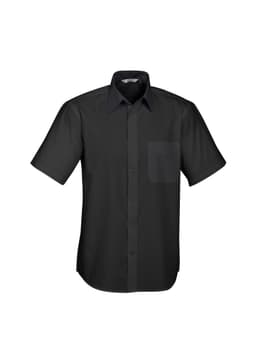 A short sleeve button-up shirt in black featuring a patch pocket and a collar. The shirt has a logo on it.