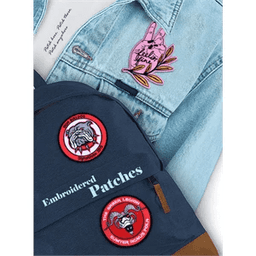 A blue denim jacket featuring a pink embroidered patch of a plant and a backpack with red embroidered patches.