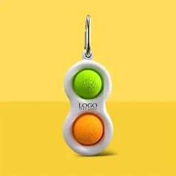 A green and orange Push Pop Bubble Fidget Toy keychain with a white holder and a logo.