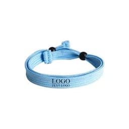 An adjustable double-layer friendship bracelet in light blue with a logo.