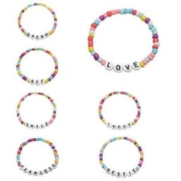A collection of colourful beaded elastic bracelets featuring words like "LOVE" and "BESTIE" in white letters.