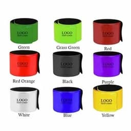 A selection of reflective slap bracelets in various colours: green, grass green, red, red orange, black, purple, white, blue, and yellow.