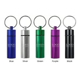 A series of five waterproof pill box keychains in blue, silver, green, purple, and black, each with a keyring.