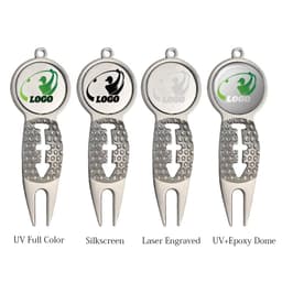 A classic golf divot repair tool with a ball marker, featuring a silver finish and textured grip. It includes a logo.