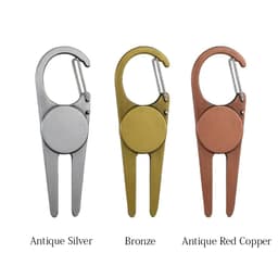 A golf divot tool with clip hook in antique silver, bronze, and antique red copper colours. Each tool features a logo.