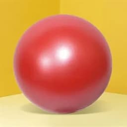 A shiny red stress ball on a yellow and light yellow backdrop, featuring a smooth surface and round shape.