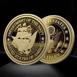 A close-up of two gold-coloured custom 3D die struck mint coins featuring detailed designs and inscriptions.
