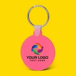 A pink silicone round key tag with a metallic keyring and space for a logo.