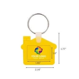A house-shaped silicone keychain in yellow with a keyring attachment and a space for a logo. Dimensions included.
