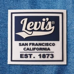 A blue and white 3D silicone patch featuring a logo and text associated with San Francisco, California.