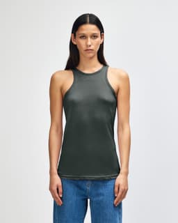 A dark green women's racerneck tank top with a fitted design, featuring a logo.