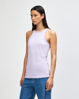 A lightweight lilac racerneck tank top with a fitted style, featuring a branding logo.