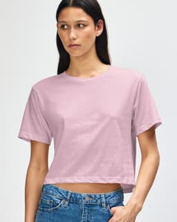 A pink women's fine jersey boxy t-shirt with short sleeves, featuring branding.