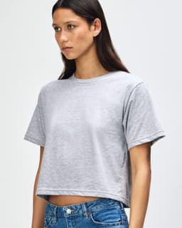 A grey boxy T-shirt made from fine jersey fabric, featuring short sleeves and a casual fit.