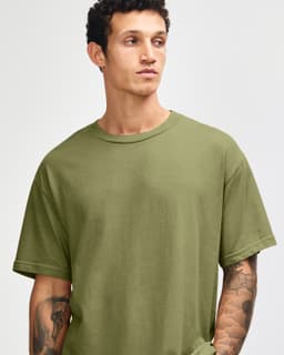 A unisex heavyweight cotton T-shirt in olive green, featuring a relaxed fit and crew neck. Includes branding.