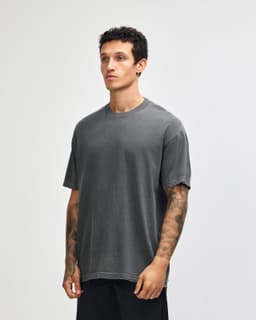 A unisex heavyweight cotton t-shirt in a slate grey colour, featuring a relaxed fit and a logo.