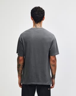 A unisex heavyweight cotton T-shirt in a garment-dyed grey, featuring a plain back and relaxed fit.