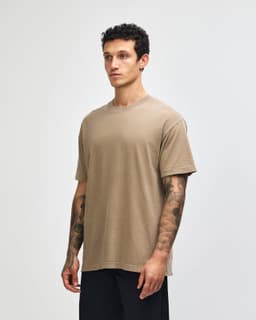 A unisex heavyweight cotton t-shirt in a muted brown colour, featuring a relaxed fit and short sleeves.