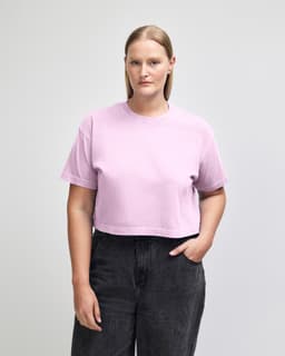 A pink crop boxy T-shirt made of heavyweight cotton, featuring short sleeves and a relaxed fit.