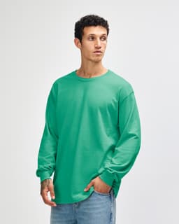 A lightweight cotton unisex long sleeve T-shirt in a soft mint colour with a relaxed fit. It features a logo on the chest.