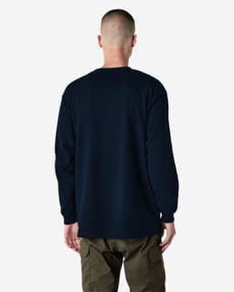 A person wearing a heavyweight cotton unisex long sleeve t-shirt in navy, viewed from the back. The shirt has a logo.
