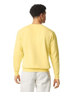 A lightweight crewneck sweatshirt in soft yellow, featuring a simple design and a logo on the back.