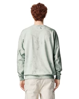 A crewneck sweatshirt in a soft green shade, featuring a textured design and a logo on the back.