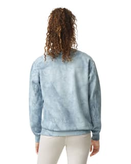 A crewneck sweatshirt in a blue marble pattern, featuring a logo and a relaxed fit.