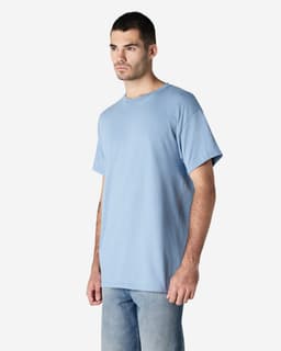 A blue Gildan Ultra Cotton adult t-shirt worn by a person, featuring a simple design and a logo.