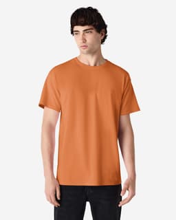 An orange Gildan Ultra Cotton adult T-shirt displayed on a model, featuring a round neck and short sleeves.