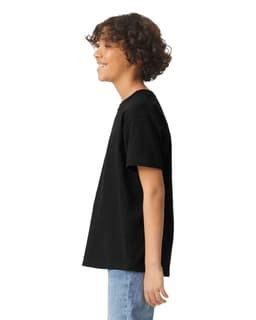 A black youth short sleeve T-shirt displayed on a person from the side, featuring a plain design and a logo.