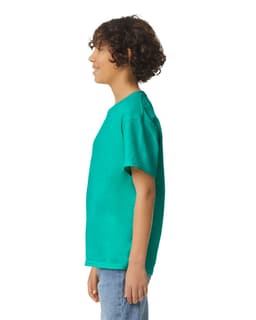 A youth short sleeve t-shirt in vibrant teal, featuring a logo on the front, displayed from the side.