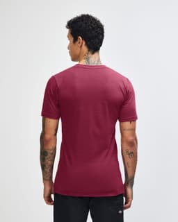 A maroon unisex short sleeve T-shirt with a plain back and a logo on the neckline.