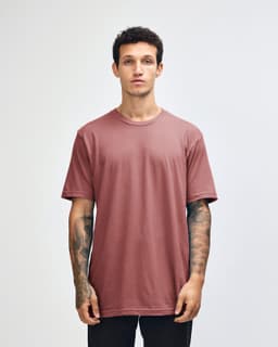 A unisex fine jersey short sleeve t-shirt in a pink colour, featuring a simple design and a logo on the front.