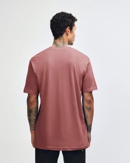 A back view of a pink unisex short sleeve T-shirt, featuring a simple design and casual fit.