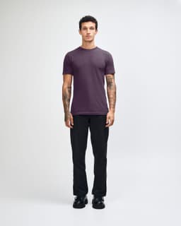 A unisex fine jersey short sleeve t-shirt in a deep purple colour, featuring a logo.