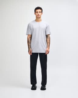 A unisex fine jersey short sleeve T-shirt in grey, featuring a simple design and a logo.