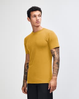 A unisex short sleeve T-shirt in mustard yellow, featuring a simple design and a logo.